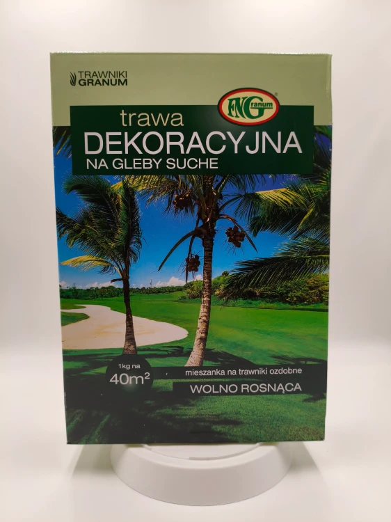 Pudełko trawy Dekoracyjnej Granum z palmami w tle sugeruje odporność na suszę.