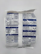 Tył worka 1 kg AZOFOSKA zawierający tabelę dawkowania dla warzyw, drzew i trawników.